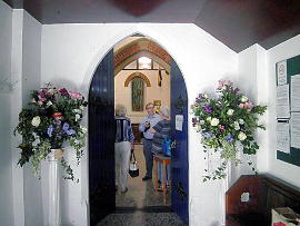 Photograph of 'Little Miss Muffet' at the Entrance to St Peter's Flower Festival 7 May 2018